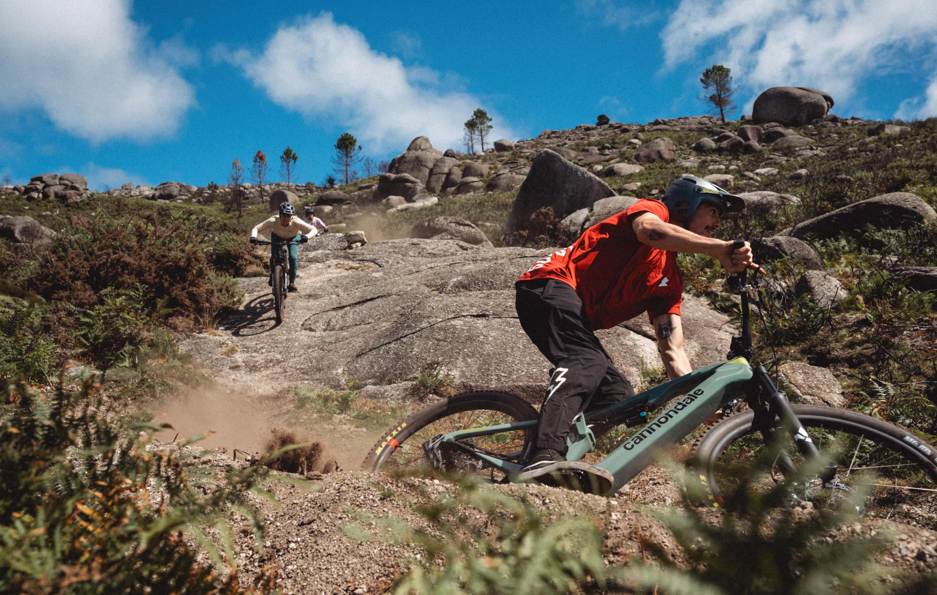 picture of two people riding mountain bikes downhill